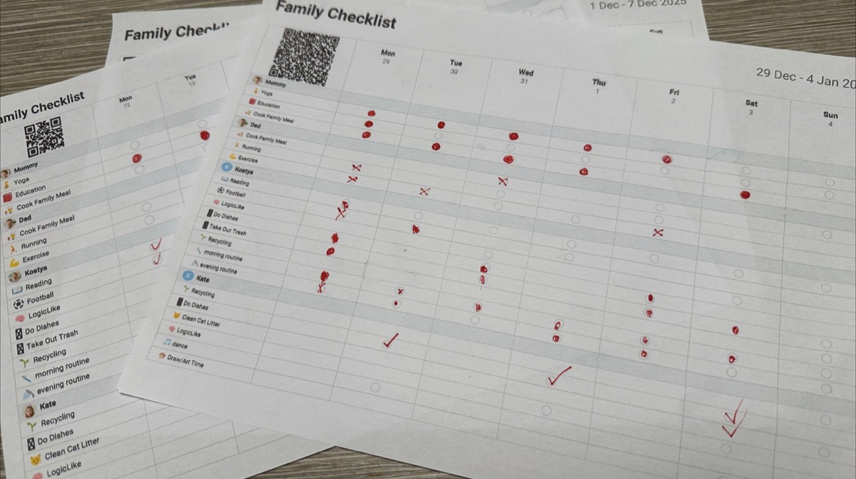 Printed family checklists on the fridge with handwritten check marks